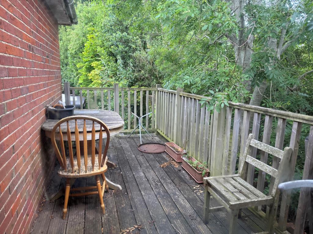 Lot: 61 - TOWN CENTRE BUILDING COMPRISING TWO SHOPS, A FLAT AND WITH SCOPE FOR FURTHER SUB-DIVISION - The Decking Area from The Kitchen Window